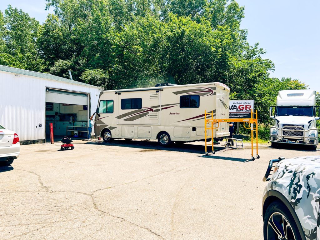 Large RV receiving ceramic coating and exterior detailing at Lava GR Detailing in Wyoming Michigan